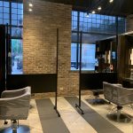 - Spa Bleü in West Dundee, St. Charles and South Barrington, IL A modern Aveda Salon interior with two styling chairs, protective plastic barriers, large windows, brick walls, and overhead track lighting—perfect for a fresh cut or to purchase Salon Gift Cards. - Spa Bleü in West Dundee, St. Charles and South Barrington, IL